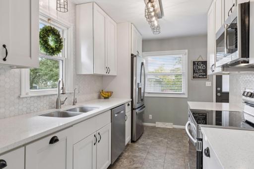 Tile backsplash, quartz counters,