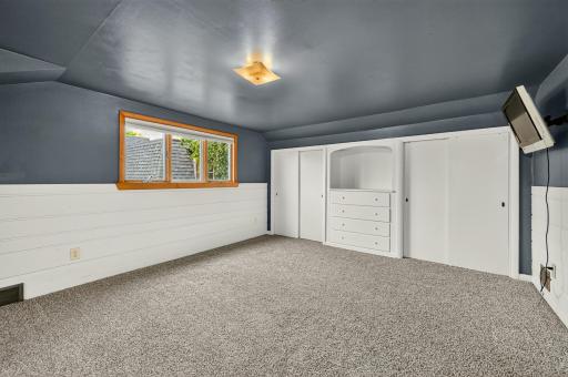 Upper level bedroom with huge closets and built-ins.