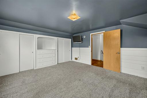 Upper level bedroom with new carpeting and huge closets and built-ins.