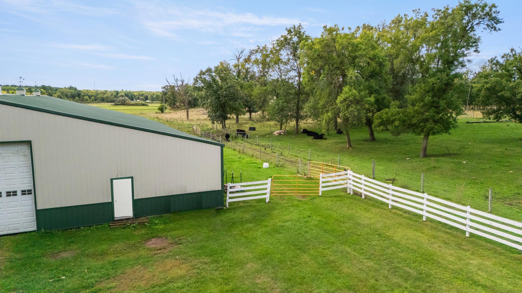 Fenced pasture set up next to buildings!