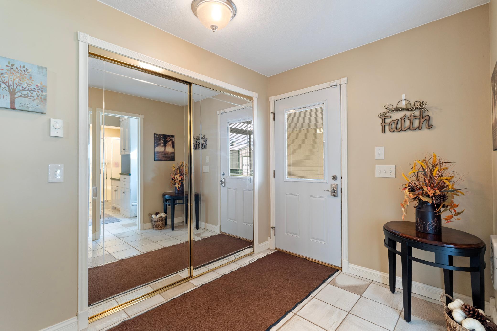 Main entrance off breezeway - lots of storage and closet space throughout!