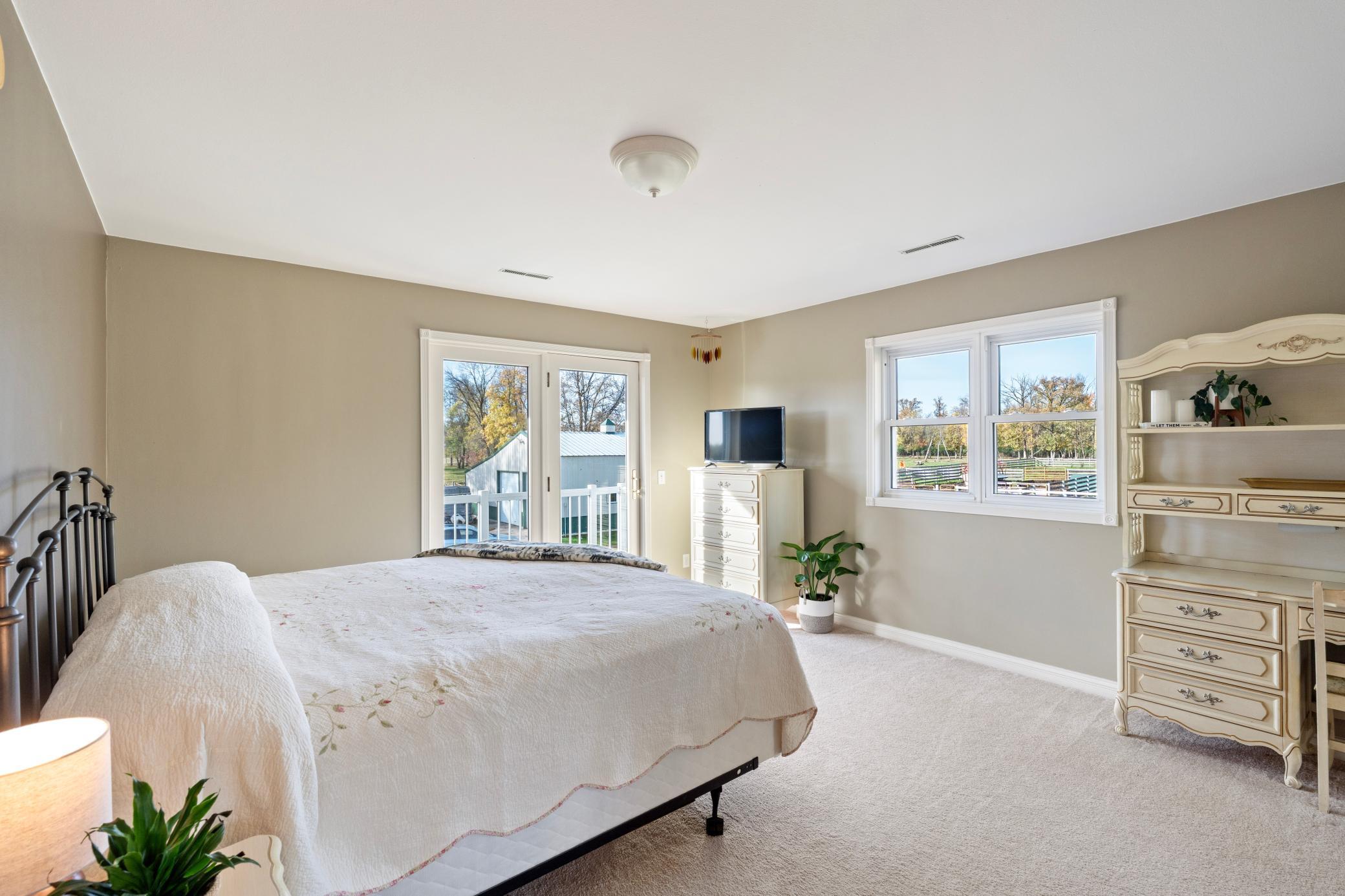 Upper level bedroom with balcony to South