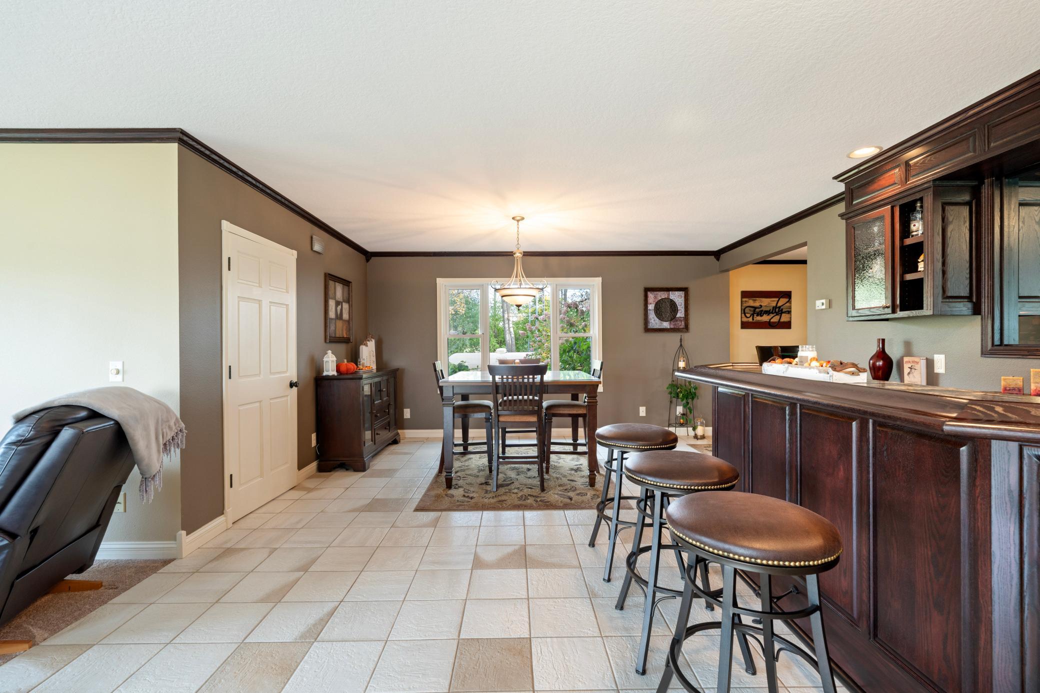 Great room view of dining area and laundry on main floor