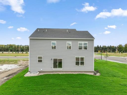 Exterior view of Richmond D - irrigation and basic landscaping included. Model pics may vary from actual.