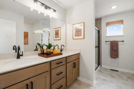 Primary bathroom with dual sinks, soft-close drawers, and beautiful fixtures