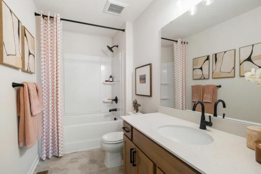 Upstairs main bath with tub/shower, large vanity, beautiful fixtures and soft-close drawers!