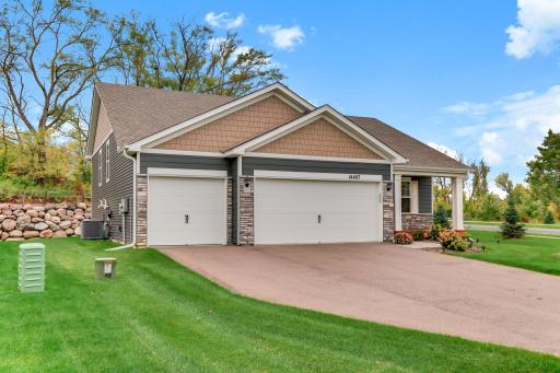 Welcome to 14487 Fernbrook Lane, located in Cypress Cove neighborhood. Beautiful corner lot, 3 car garage, great curb appeal and cozy front porch.