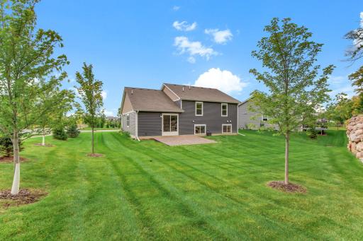 Beautiful corner lot with expansive yard and river rock patio.