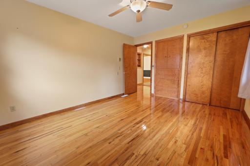 MF bedroom. Built in dresser and hardwood floors.