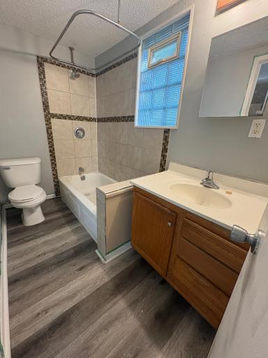 Upper level bathroom with new floors and freshly painted