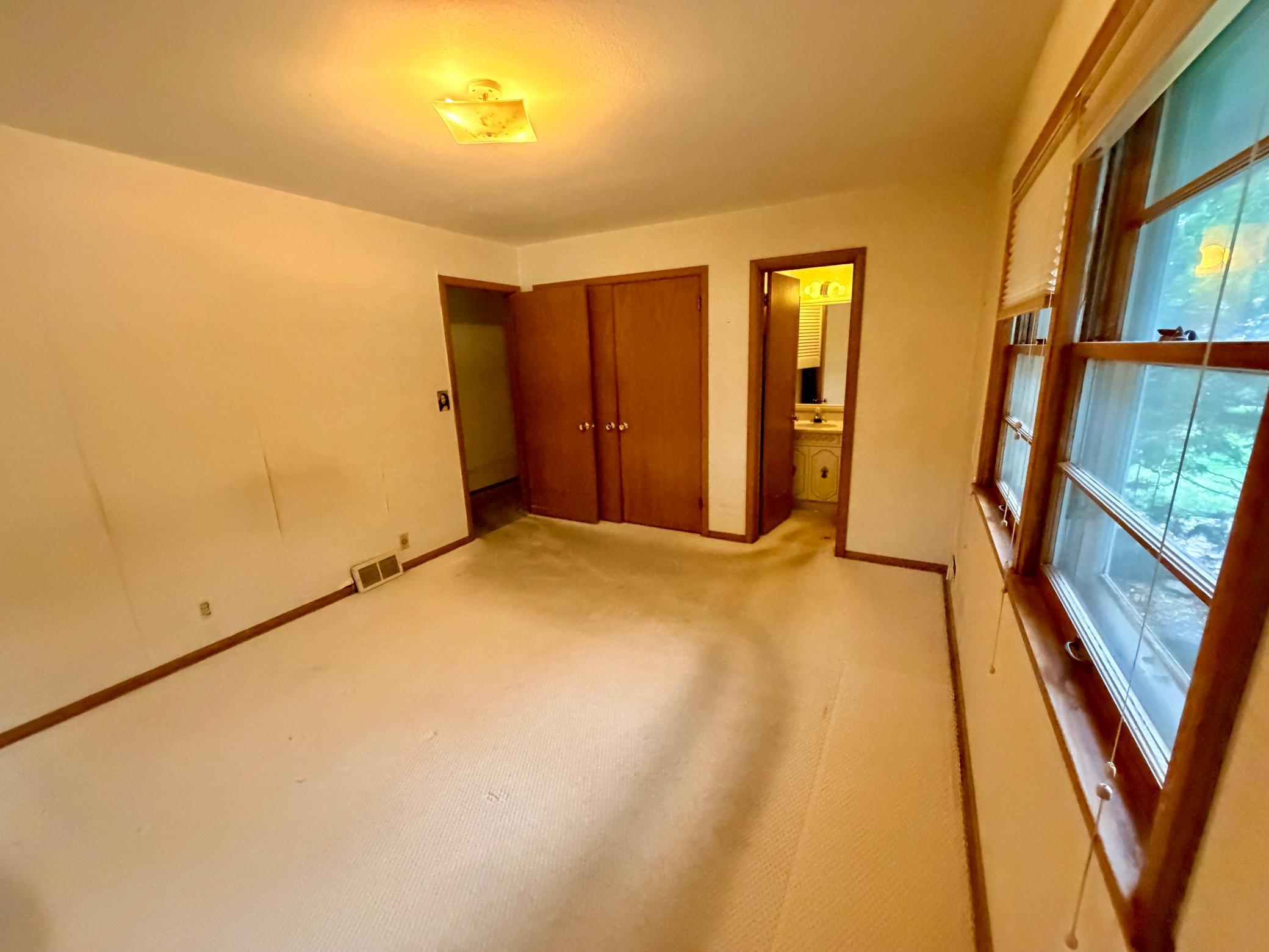 The corner primary bedroom has an en-suite half bath.
