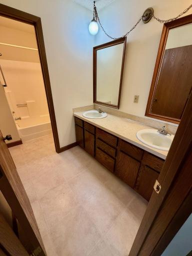 Spacious bathroom with dual sink vanity.jpg