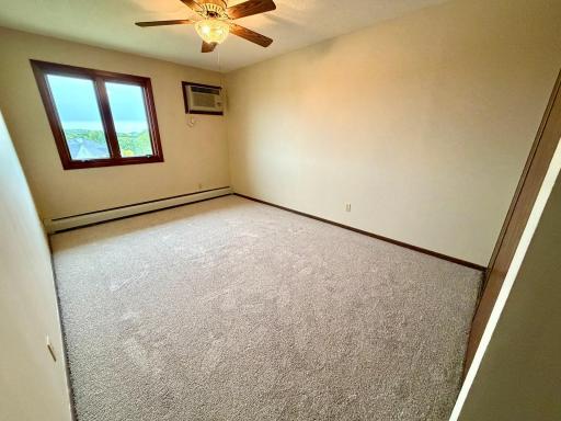 primary bedroom fresh pain new carpet ceiling fan.jpg