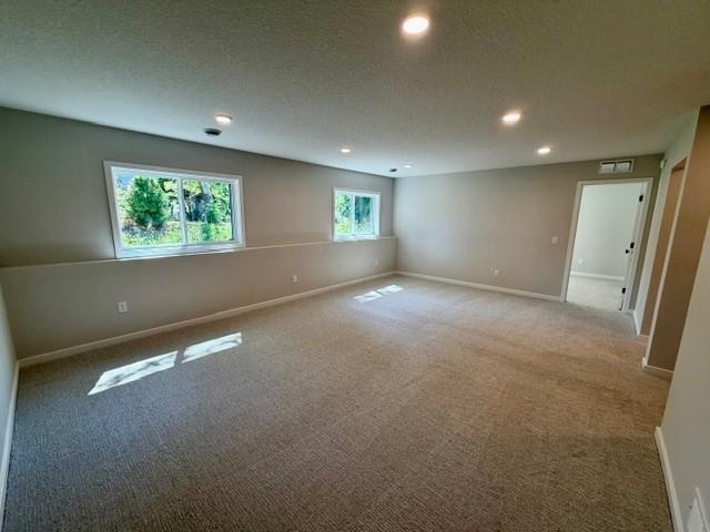 Finished lower level include large family room, game area, 5th bedroom and another bathroom and linen closet! This home is under construction and almost complete, photo is from similar home.