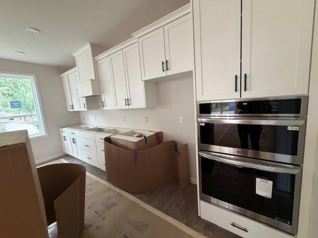 Stunning kitchen with a 10' center island kitchen island, wall ovens, gas cooktop and box hood! And you will also love our super-sized Morning Kitchen pantry!....