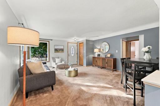 Spacious living room with front entrance and coat closet