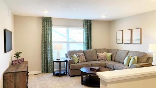 The upper level provides a large 2nd family room/game room, 4 bedrooms, jack and jill bath, 3rd bath, primary suite with large walk-in closet! Photo of model home, colors and finishes vary.