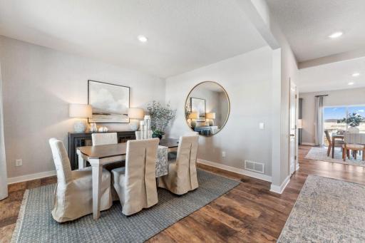 Open and inviting, you'll find space for all your family's needs. Photo of model home, colors and finishes are similar.