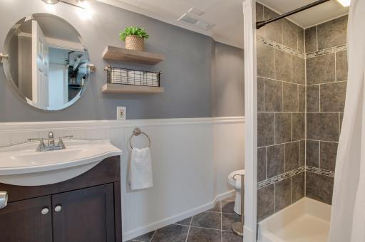 Updated 3/4 bathroom in the basement with another tiled shower
