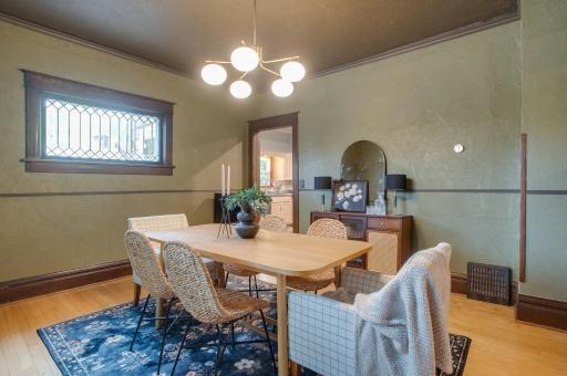 Updated light fixture but original wood work and hardwood floors