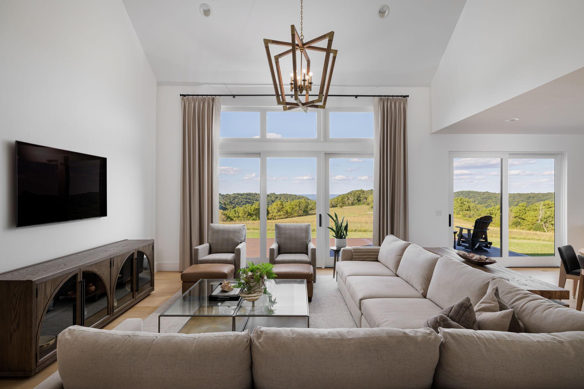 5 Expansive Great Room with Statement Chandelier & Furnishings Available.jpg