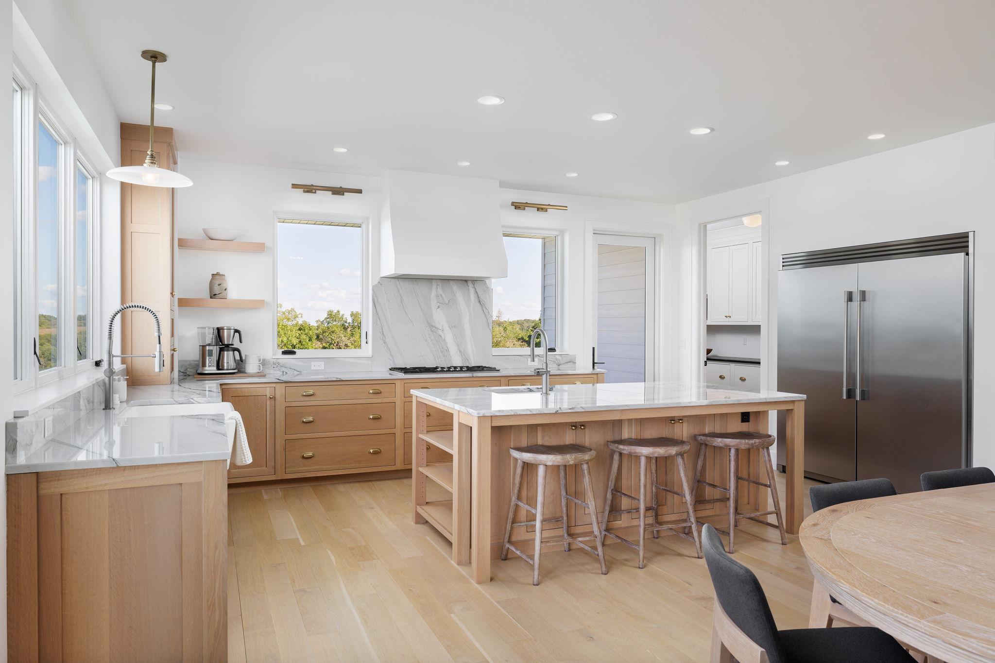 8 Expansive Kitchen with Oversized Island, Prep Sink, & Seating.jpg