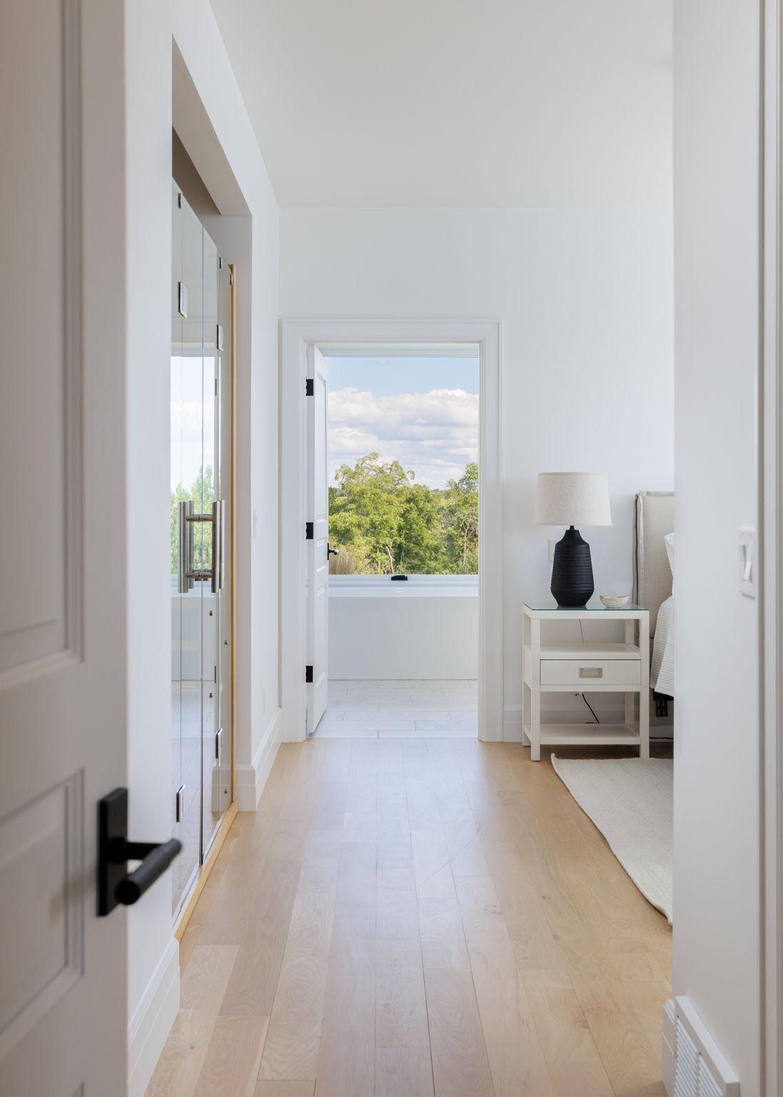 14 Pimary Suite with Sightline to the Soaking Tub & Views Beyond.jpg
