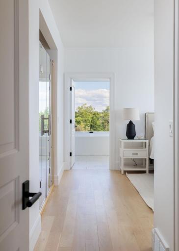 14 Pimary Suite with Sightline to the Soaking Tub & Views Beyond.jpg