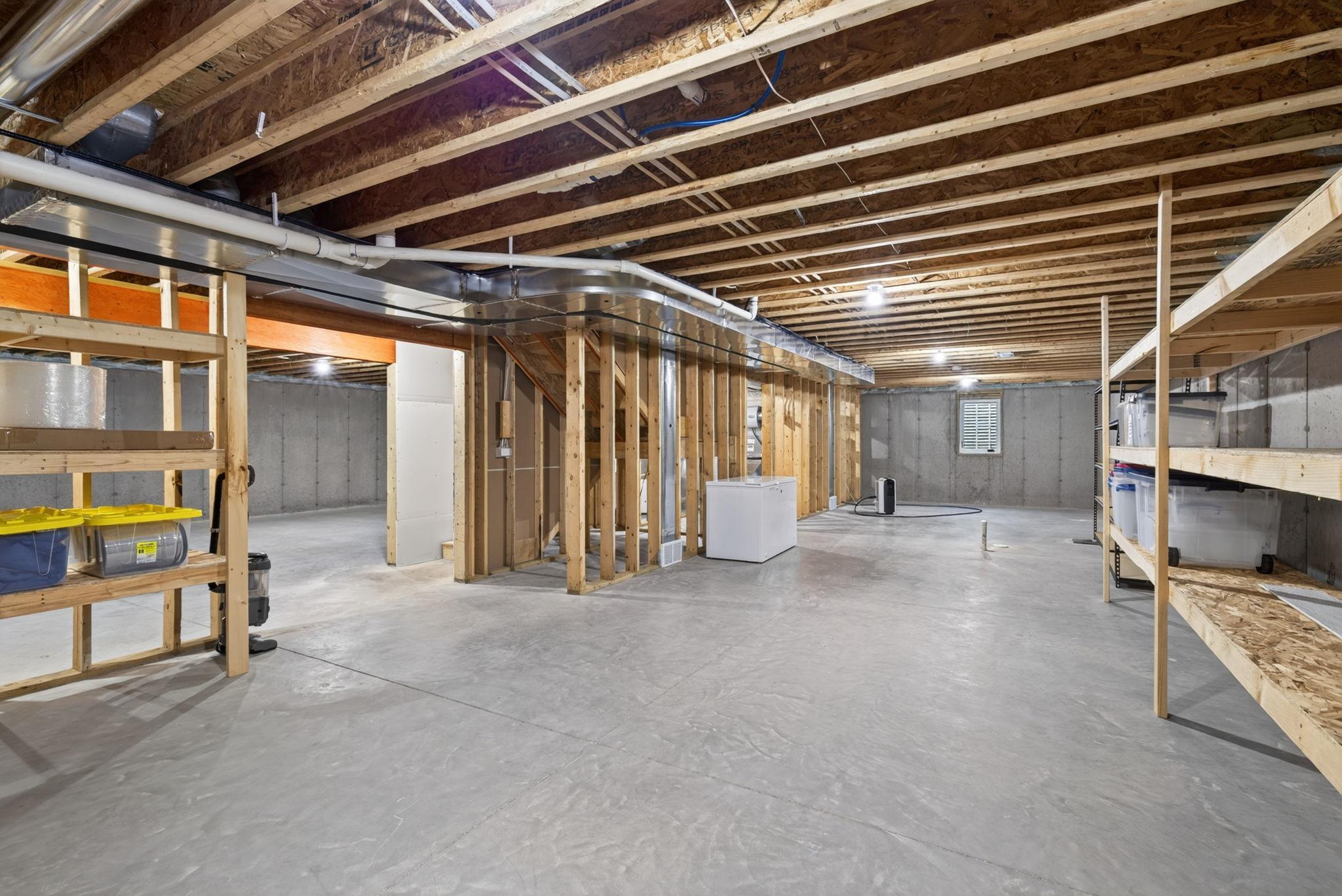 43 Lower Level - Flexible Space with Built-In Storage Shelving.jpg