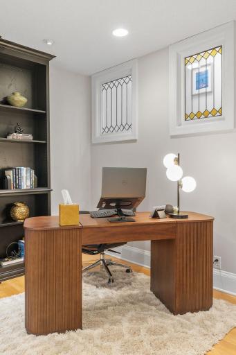 Main level office space with stain glass window accents
