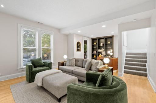 Comfortable main level living room area with flex space for an office or sitting area.