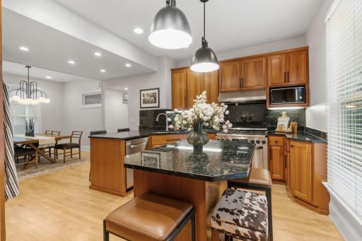 The gourmet kitchen blends seamlessly with the dining room space creating a perfect setting for entertaining friends and family.