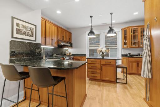 Gourmet kitchen with granite counter tops, ample storage and prep space
