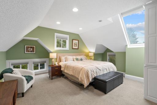 Primary bedroom archicturally designed to maximize natural light (windows have automatic blinds)