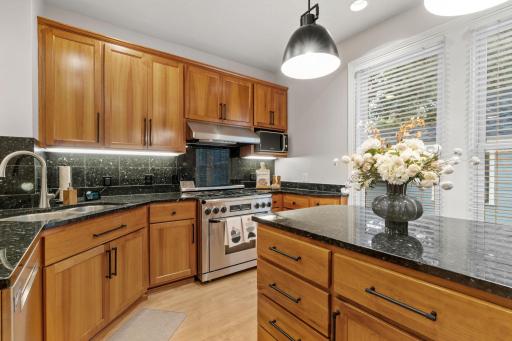 Gorgeous gourmet kitchen with ample cabinet, storage and prep space