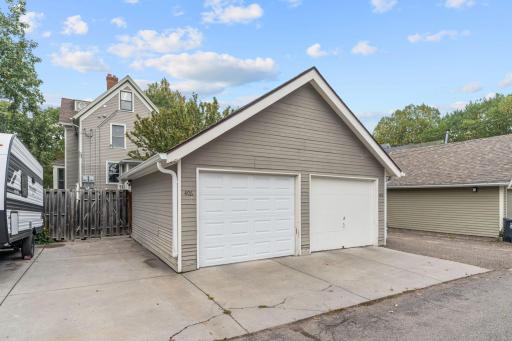 View of garage from alley. Unit 408 has the East side of the garage for inside parking and the cement slab on the West side of the garage for outside parking. Free street parking is also available for guests.