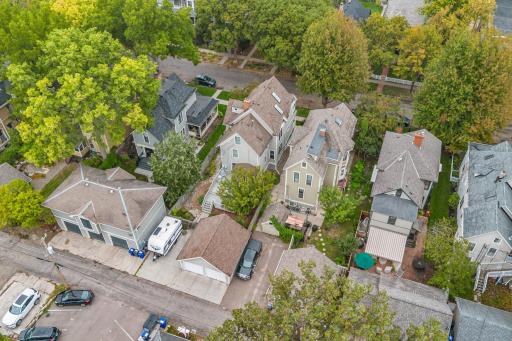 Aerial view of home showing alley, garage and back yard area of home.