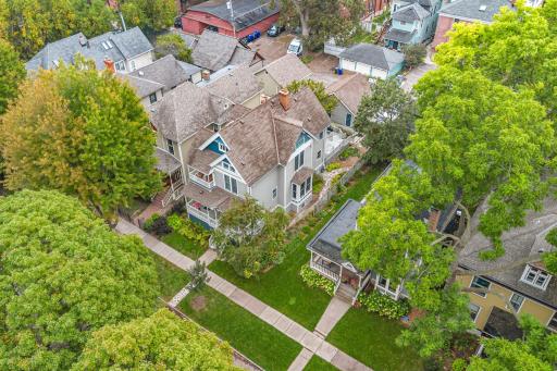 Aerial view of property showing porch, private balcony and front exterior of home