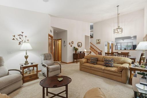 Open layout seamlessly connects the dining room, kitchen, and living spaces.