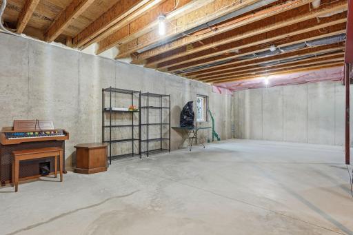 Massive unfinished lower level offers exceptional storage and opportunity for future finished living space.