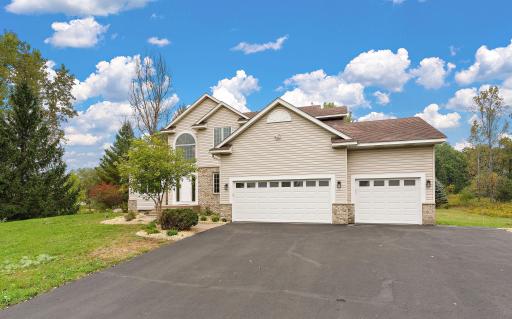 Updated driveway and landscaping and brand new garage doors