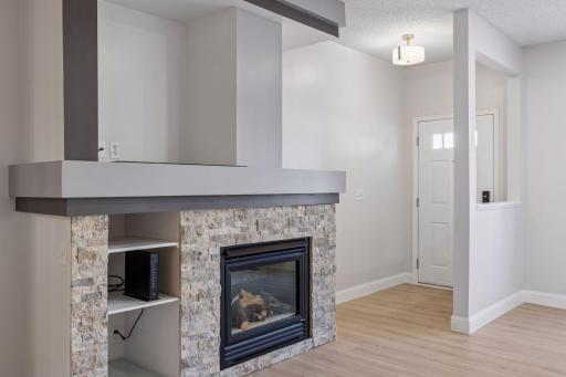 Stay warm and cozy all season long with the beautiful gas fireplace as the focal point of the living area.