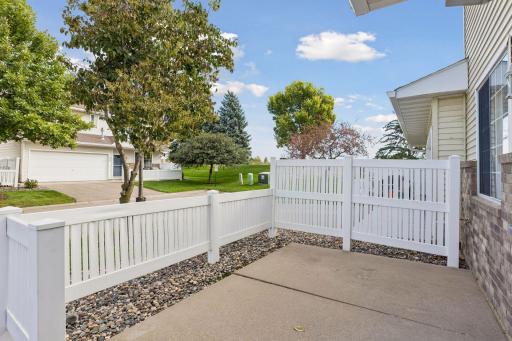 Enjoy your private outdoor retreat with a cozy fenced-in patio, perfect for relaxing or entertaining.