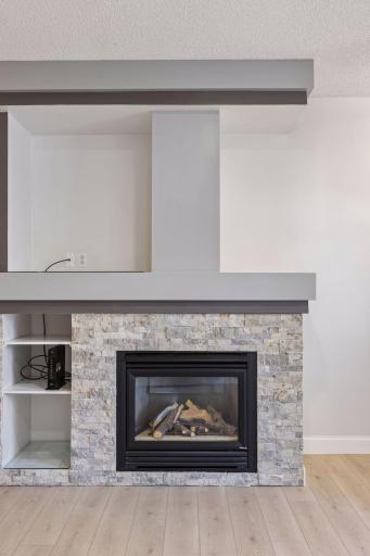 Stay warm and cozy all season long with the beautiful gas fireplace as the focal point of the living area.