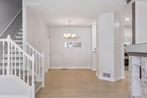 The dining room features a beautiful wall color that enhances the warm and inviting atmosphere.