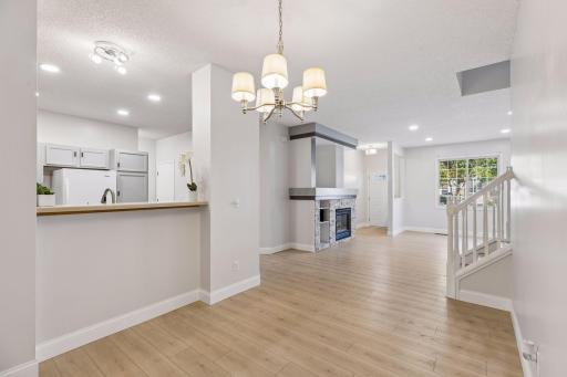 The dining room overlooks the living room and kitchen, creating the perfect space for entertaining