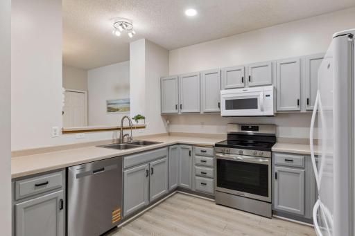 The kitchen is equipped with a brand-new microwave, oven and dishwasher for added convenience.