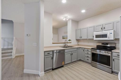 The kitchen sink overlooks the dining room, allowing for a connected and open feel throughout the main level.