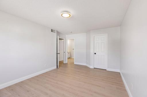 The spacious primary bedroom offers plenty of room to relax and unwind after a long day