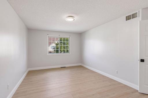 The primary bedroom features a large walk-in closet and a walk-through entrance to the full bathroom.